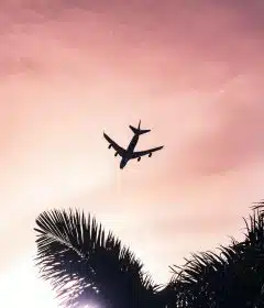 airplane under cloudy sky during daytime